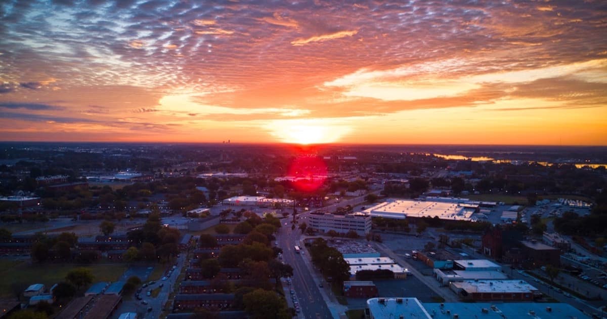 Aerial view of Norfolk, Virginia at sunrise with the harbor on the horizon